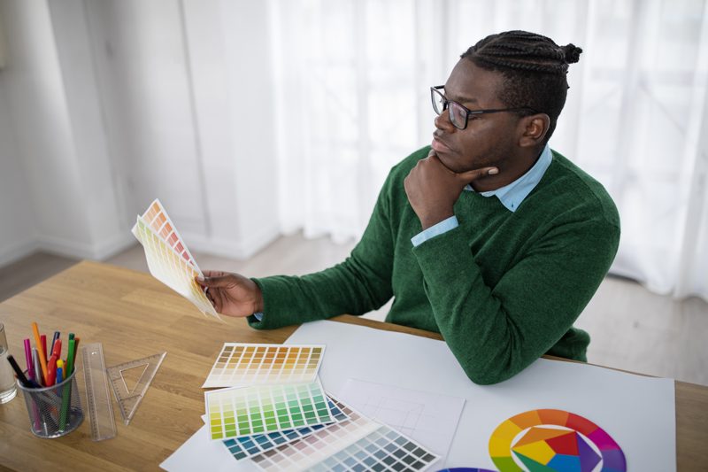 Designer choosing the colors of a brand identity